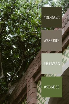 there is a brick wall with green leaves on it and the words bjbe 534