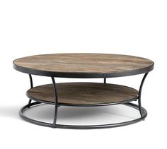 a round wooden table with metal legs and a shelf on one side that holds two shelves