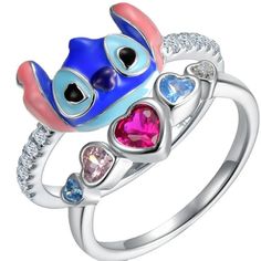 an animal ring with hearts and eyes on it's sides, set in white gold