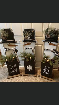 three suitcases with christmas decorations on them are sitting in front of a white door