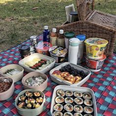 a picnic table with food and drinks on it