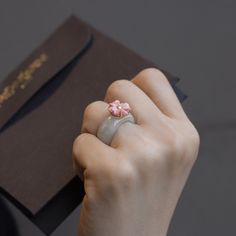 Everybody loves this ring. Don't think about the band size, just order your size. 6 will be a bit loose. 6.5 will be fit very well. 🌱Handcrafted ring 🌱Made of 925 silver (gold plating) and natural jade (not A), synthetic flower, not coral 🌱Authentic Korean jewelry 🌱Handmade in Korea 🌱Made to order 🌱Free standard shipping from Seoul Korea with tracking included 🌱Take approximately 10-30 days to arrive worldwide 🌱Each piece is thoughtfully designed and handmade by a highly skilled master a Enamel Open Ring With Gemstone For Gift, Modern Crystal Ring With Round Band, Round Gemstone Enamel Ring Gift, Pink Enamel Round Ring For Wedding, Round Enamel Ring With Gemstone For Gift, Pink Round Enamel Ring For Wedding, Elegant Stackable Enamel Ring As Gift, Elegant Stackable Enamel Ring For Gifts, Pink Round Enamel Wedding Ring