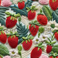 some red and green strawberries are on a white surface with other items around them