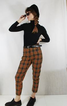 Fully lined check tartan patterned tapered Mom jean style chino/Capri pants in navy and chestnut brown colourway. Other colours available in our shop (see final photo). - Flattering high rise at the waist and narrow at the ankle - Two pockets - Belt loops - Fully lined Outer material is 100% cotton and looks great paired with Doc Martens and a navy ribbed turtle neck. Sizing: Sizes UK 6, 8, 10, 12, 14, 16, 18, 20 & 22 available, please see the last photo for sizing chart. Condition: New. Pos Plaid Tapered Leg Bottoms For Fall, Tapered Leg Plaid Bottoms For Fall, Retro Plaid Pants For Fall, Vintage Plaid Pants For Fall, Plaid Tapered Leg Pants For Fall, Vintage Plaid Pants For Work, Vintage Plaid Bottoms For Work, Vintage Ankle Pants For Fall, Retro Style Winter Workwear Pants