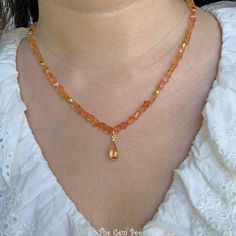 Thank you for coming in!  Breath-taking gem imperial topaz nugget bead necklace with a beautiful center pendant and 18k solid gold spacers and clasp! 17" to 19" adjustable length necklace! You'll get the necklace you see! SIZE of the beads: 5.2mmx4mm-5mmx6mm, 6.68mmx13mm bezel MATERIAL: 18k solid gold, Imperial Topaz Gold Rondelle Crystal Necklace With Gemstone, Gold Citrine Beaded Necklace For Gift, Elegant Orange Crystal Necklaces With Gemstone Beads, Gold Single Strand Gemstones As Gift, Gold Beaded Gemstones As Gift, Gold Beaded Gemstones For Gift, Beaded Gold Gemstones For Gift, Pear Pendant, Imperial Topaz