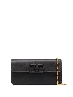 Black leather mini VLogo crossbody bag from VALENTINO GARAVANI featuring gold-tone hardware, foldover top, concealed magnetic fastening, chain-link shoulder strap, main compartment and internal logo patch. Logo Material, Black Cross Body Bag, Leather Mini, Valentino Garavani, Chain Link, Patch Logo, Leather Wallet, Crossbody Bag, Shoulder Strap