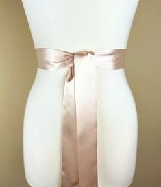 "Narrow Champagne Sash  Champagne Satin Sash  Champagne Beige Sash Belt  Bridesmaid Sash  Champagne Wedding Sash, Bridal Sash  This Satin Swank® narrow waist sash is the perfect finishing touch for your wedding, bridesmaid, or special occasion dress, or just the right piece to add instant polish to your dress or top. Depending on your waist size and the length you choose, you can wrap the sash around your waist once or up to three times. You decide whether to tie the sash in a bow or a simple kn Wedding Sash With Tie Back, Satin Bridal Belt For Bridesmaids, Satin Sash With Bow For Bridesmaids, Fitted Satin Bow Sash For Bridesmaids, Bridesmaid Sash With Satin Bow, Bridesmaid Satin Sash With Satin Bow, Bridesmaid Satin Sash With Bow, Fitted Satin Bridal Belt For Bridesmaid, Wedding Satin Tie Back Sash