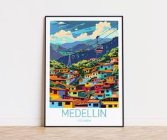 a poster with the name medellin in front of a white wall and wooden floor