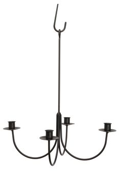 a black chandelier with five candles on it