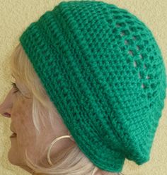 a woman wearing a green knitted hat