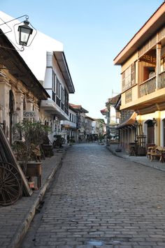 an empty cobblestone street lined with buildings