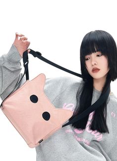 The purr-fect fusion of feline charm and functional design - the Noxxon Messenger Bag with Cat Ears and Eyes! Let your playful side roam free as you strut the streets with this quirky yet stylish accessory. Cute Cat Design Shoulder Bag, Trendy School Shoulder Bag With Cat Design, Casual Pink Bag With Animal Design, Trendy Cat Design Shoulder Bag For School, Trendy Crossbody Shoulder Bag With Cat Design, Cat Design Crossbody Travel Bag, Trendy Black Shoulder Bag With Cat Design, Trendy Bags With Cat Design, Trendy Cat Design Crossbody Shoulder Bag