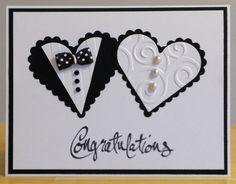 two heart shaped cards with black and white designs on them, one has a bow tie and the other says congratulations