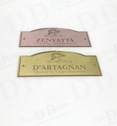 two metal name tags on top of each other