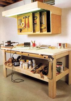 a workbench with lots of tools on it