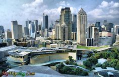 an aerial view of a city with tall buildings