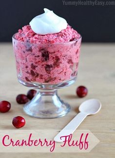 cranberry fluff with whipped cream in a glass bowl on a wooden table