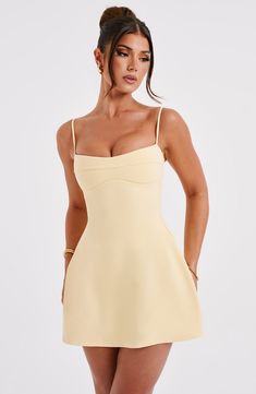 Keep it fun and flirty in the Dakota dress. everyone's fave mini of the season. Made in our lightweight stretch crepe. this figure-hugging design snatches in at the waist and flares into an A-line skirt. The neckline has a slight sweetheart shape with seam detail. while the straps are adjustable for your perfect fit.   Colour: Lemon. Premium stretch crepe fabric. Fully lined. Slight sweetheart neckline. Seam detail on bust. Shaped underbust. A-line shape skirt. Adjustable straps. Invisible zipper to reverse. Mini length. Model is an XS and is wearing an XS. Homecoming Dresses Corset, Midi Dress Wedding Guest, Maxi Dress Sale, Prom Dress Shopping, Lemon Dress, Sparkle Dress, Mini Dresses For Women, Stretch Crepe, Dresses By Length