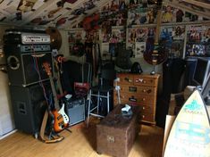 a room filled with guitars and other musical equipment