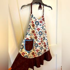 a dress hanging up on a door hanger