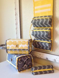 three pieces of luggage sitting on top of a white counter next to a mirror and door