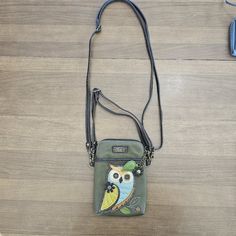 Chala Handbags Owl Gen A Cellphone Crossbody Handbag-Convertible Strapdimensions: 5" X 7.5" X 1" Strap Adjustable: 7"~30" Small Front Pocket Adorned With Our Owl A Design Adjustable Strap - Turn Bag Into A Purse, A Crossbody Bag, Or Even A Pouch! Top Zipper Closure Leaf Zipper Pull Soft Lining Inside 3 Credit Card Slots Inside 2 Adjustable Straps That Are Detachable Extra Padding Throughout Bag To Protect Your Cell Phone Materials: Faux Leather Color: Olive Description: Owl A - Cell Phone Xbody Casual Phone Bag With Detachable Strap, Satchel Shape, Casual Satchel Phone Bag With Detachable Strap, Casual Phone Bag With Removable Pouch, Green Satchel Phone Bag With Cell Phone Pocket, Casual Phone Bag With Detachable Strap, Casual Phone Shoulder Bag With Detachable Strap, Green Phone Bag With Adjustable Strap For Everyday Use, Casual Phone Shoulder Bag With Removable Pouch, Casual Green Phone Bag For Everyday