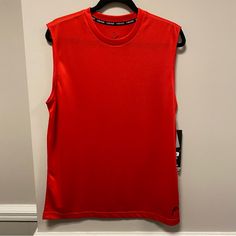 Get Ready For High-Performance Workouts With This Head Men's Tank Top. The Red Color And Sleeveless Design Provide Freedom Of Movement, While The Brand Logo Adds A Stylish Touch. Made With High-Quality Material, It Provides Durability And Comfort During Intense Activities. Perfect For Active Men, This Shirt Is A Must-Have For Your Activewear Collection. Measurements Are Approximate While Lying Flat 21” Armpit To Armpit 27.75” Long Red Moisture-wicking Athleisure Tank Top, Red Sleeveless Moisture-wicking Activewear, Red Sleeveless Activewear For Training, Red Crew Neck Tank Top For Sports, Red Athleisure Tank Top For Training, Red Moisture-wicking Tank Top For Gym, Red Tank Top For Workout, Sporty Red Tank Top, Red Sleeveless Activewear For Gym