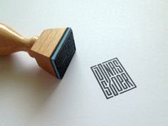 a rubber stamp with the words doing soror printed on it and a wooden handle