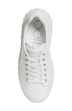 A lightweight platform wedge textured to resemble the facets of a cut diamond give this whiteout sneaker an elevated boost. Removable insole Lace-up style Leather upper and lining/rubber sole Made in Italy Designer Shoes Modern White Platform Sneakers With Textured Sole, Luxury White Platform Sneakers With Textured Sole, White Leather Platform Sneakers With Translucent Outsole, White Low-top Wedge Sneakers With Lug Sole, White Platform Sneakers With Lug Sole, White Chunky Sneakers With Lug Sole, White High-top Wedge Sneakers With Lug Sole, Modern White Leather Wedge Sneakers, Modern White Synthetic Wedge Sneakers