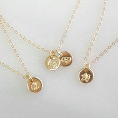 Classic and elegant, our dainty necklace is hand stamped with birth month flowers just for you. A must have for your dainty jewelry collection. Makes a meaningful, wonderful Mothers Day gift too! •Thick 6mm disc •Choose up to 4 discs•100% 14kt Gold-Filled, Sterling Silver, or Rose Gold-Filled.•Stamped by hand with your choice of birth flower•See our chart for available symbols•Satin finish Water friendly Mothers Day Jewelry Gifts, Dainty Birth Flower Charm Necklace, 14k Gold Birth Flower Charm Necklace For Gift, 14k Gold Birth Flower Charm Necklace As Gift, Everyday Birth Flower Charm Necklaces, Gold Birth Flower Pendant Necklace, Month Flowers, Birth Month Flowers, Unique Gemstones