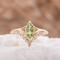 "Vintage style victorian womens wedding ring, Antique 14k solid yellow gold marquise cut green peridot engagement ring, Promise ring for her WE OFFER UNLIMITED PERIOD INSTALLMENTS PLAN This is a beautiful, stunning, feminine ring that works well for all occasions, styles, and ages. You will love it! Ring information Main stone: Peridot Approximate size: 8x4mm Accent stones: White cubic zirconia Approximate size: 1.5mm (5 stones) Approximate size: 1.25mm (4 stones) Metal type: Gold Metal stamp: 1 Green Marquise Diamond Ring Fine Jewelry, Gold Marquise Gemstone Wedding Jewelry, Gold Marquise Wedding Ring With Accent Stones, Elegant Peridot Diamond Ring, Elegant Peridot Jewelry With Prong Setting, Green Marquise Diamond Promise Ring, Wedding Peridot Diamond Ring In Yellow Gold, Yellow Gold Peridot Diamond Wedding Ring, Elegant Peridot Diamond Ring With Center Stone