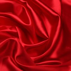 a close up view of a red satin fabric