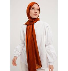 Shine Hijab Shawl - Cinnamon Glossy in texture and elegant in appearance, our shine shawl is set to be the next great addition to your wardrobe! Its sleek shine makes for an impressive final touch to formal wear so you could look and feel your best on any special occasion. FEATURES: - Glossy finish - Suitable for all seasons - Opaque (not transparent) MATERIAL: - 75 cm x 185 cm - Polyester CARE: - Hand wash separately in cold water. - Lay flat to dry. - Iron on low without steam. Made in Turkey Elegant Pashmina Shawl For Eid, Elegant Eid Pashmina Shawl, Elegant Shawl For Eid And Formal Occasions, Elegant Shawl For Formal Eid Occasions, Elegant Formal Shawl For Eid, Elegant Wedding Hijab, Elegant Fall Pashmina Shawl, Elegant Brown Hijab, Elegant Shawl For Formal Fall Events