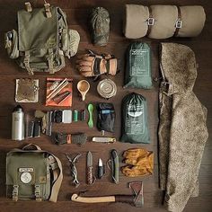 an assortment of personal items laid out on a wooden table with the contents neatly organized