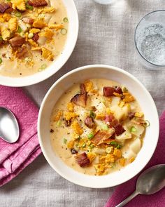 two bowls of soup with bacon and potatoes