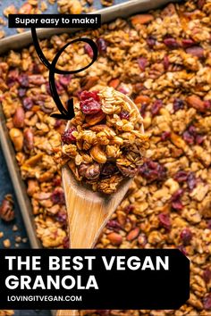 the best vegan granola recipe is in a baking pan with a wooden spoon