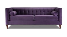 a purple couch sitting on top of a white floor