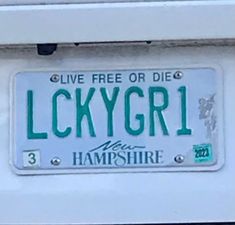 a license plate that reads luckygirl on it's front and back side, with the words live free or die