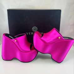 Nwt$1225 Versace Leather Triplatform Wedge Mules In Cerise Pink Color Sz 35, 5 Bold And Daring, Versace's Mules Are Made In Italy Of Luxurious Satin Enhanced With A Squared Toe. This Pair Is Anchored By A Striking Wedge Heel And Platform. Viscose/Silk Upper Square Open Toe Slip-On Style Leather Sole Made In Italy Size Leather-Covered Wedge Heel, 6.25" (160mm) Brand New From Saks Fifth Avenue!! Strikeout To Prevent Returns. Two Tiny Scuff Mark From Laying In Box At Store (See Pic - Hardly Noticea Luxury Chunky Platform Heels, Luxury Platform Wedge Sandals, Elegant Pink Wedge Sandals With Round Toe, Luxury Platform Wedge Sandals For Formal Events, Pink Wedge Sandals With Branded Heel, Designer Evening Wedge Sandals With Platform, Modern Pink Wedge Sandals With Round Toe, Designer Platform Wedge Sandals For Evening, Modern Pink Round Toe Wedge Sandals