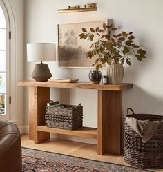 a living room with a couch, table and lamp in it's centerpiece