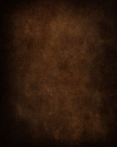 a dark brown background with some stains on it