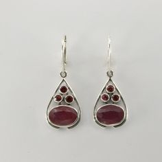 These is a pair of beautiful Earrings with Ruby. The earrings are made out of solid 925 Silver and there is no nickel or other substances causing most allergies. This makes the earrings hypo allergenic. Size of one Earring 4.1 x 1.4 cm or  1.61 x 0.55 inch You will receive the item in a gift box - perfect to surprise someone or yourself. Usually we ship on the same day we receive the payment for the order. We want you to be happy with your purchase. If you do not like what you bough can send it Oval Sterling Silver Teardrop Earrings, Natural Delivery, Raw Ruby, Teardrop Dangle Earrings, Garnet Earrings, Lovely Earrings, Beautiful Earrings, Allergies, Garnet