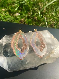 These gold holographic color shifting earrings are absolutely stunning. They are a transparent gold at a certain angle and then as soon as they shift they show a beautiful gold sparkly rainbow. They are lightweight and won't bother your ears compared to regular heavy stone *Last photo is a different color but shows the clip on option Matching necklace available, link below https://www.etsy.com/listing/856577326/holographic-geode-pendant-made-with?ref=listings_manager_grid Please note the color i Pierced Iridescent Jewelry For Party, Iridescent Pierced Jewelry For Party, Clear Pierced Jewelry For Party, Unique Gold Crystal Drop Earrings, Iridescent Drop Earrings With Matching Jewelry, Iridescent Drop Earrings Jewelry Set, Iridescent Pierced Drop Earrings, Iridescent Drop Earrings With Matching Jewelry Set, Iridescent Jewelry With Matching Drop Earrings