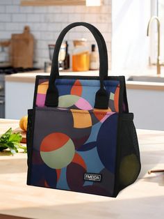 a colorful handbag sitting on top of a kitchen counter