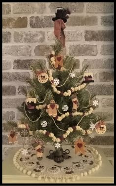 a small christmas tree decorated with teddy bears