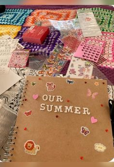 a notebook with the words our summer written on it surrounded by other crafting supplies