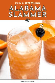 an orange and black garnish on top of a drink