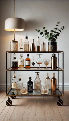 a shelf filled with bottles and glasses on top of a wooden floor next to a lamp