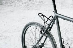 there is a bike that is parked in the snow