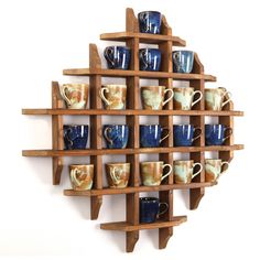 a wooden shelf with many cups on it